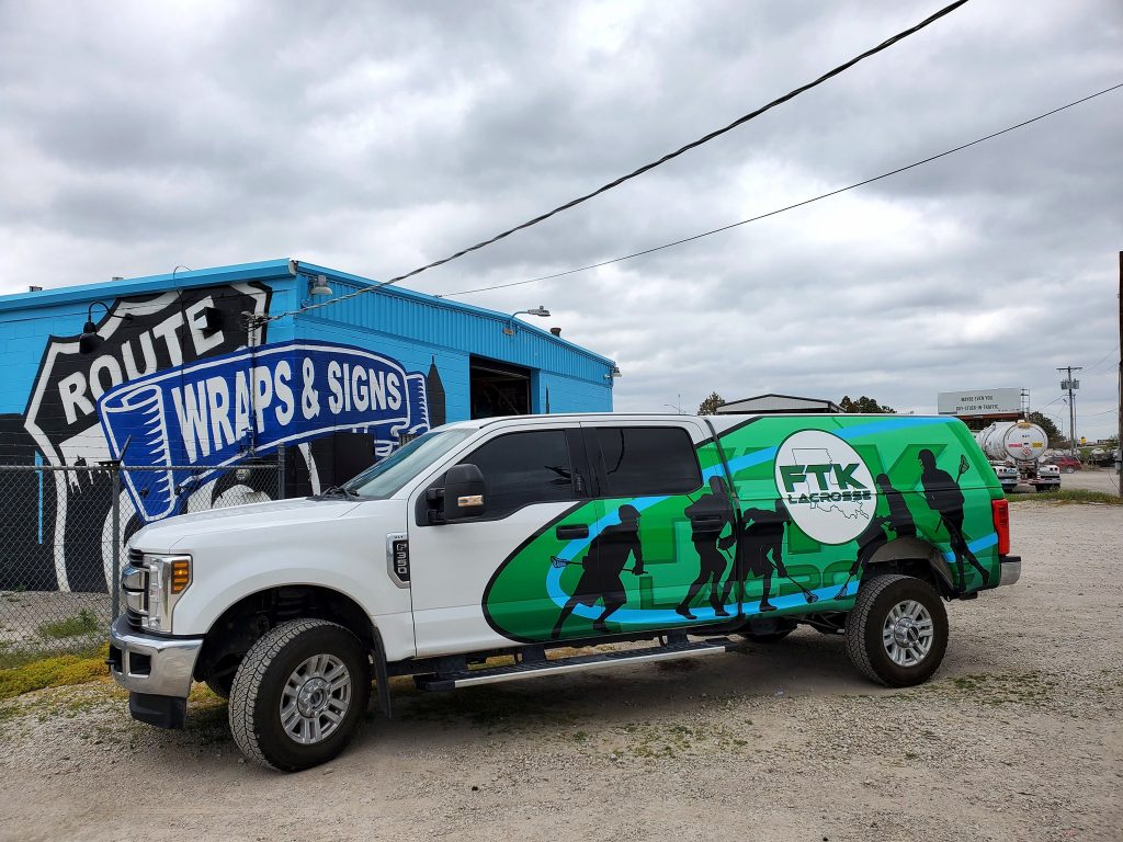 Partial wrap on an F350 with a camper shell.